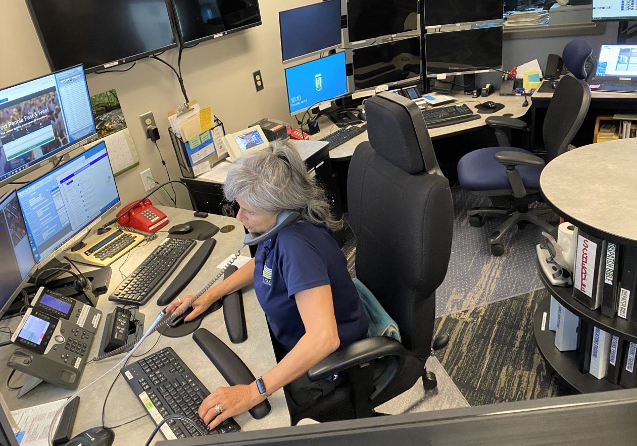 A photo of PCO Karla Melchior working in the Bel Air Police dispatch center.